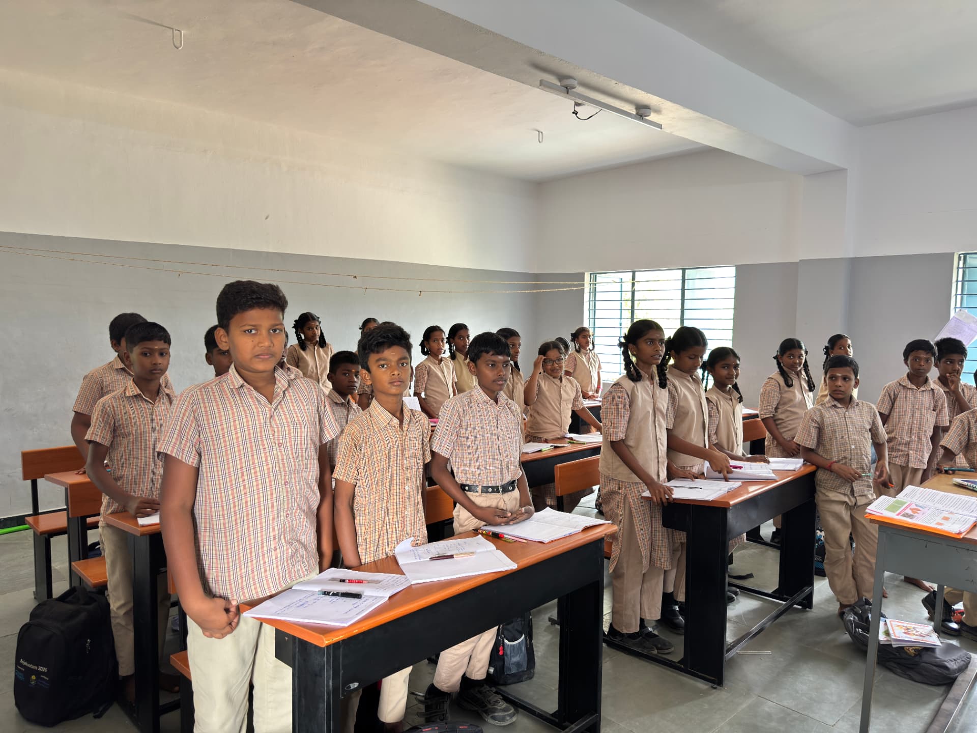 Students in a classroom at a government school supported by Aventra Foundation